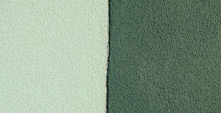Two textured walls, one light green, one dark green