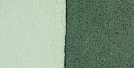 Two textured walls, one light green, one dark green