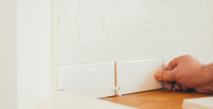 person-holding-white-tile.jpg person holding white tile